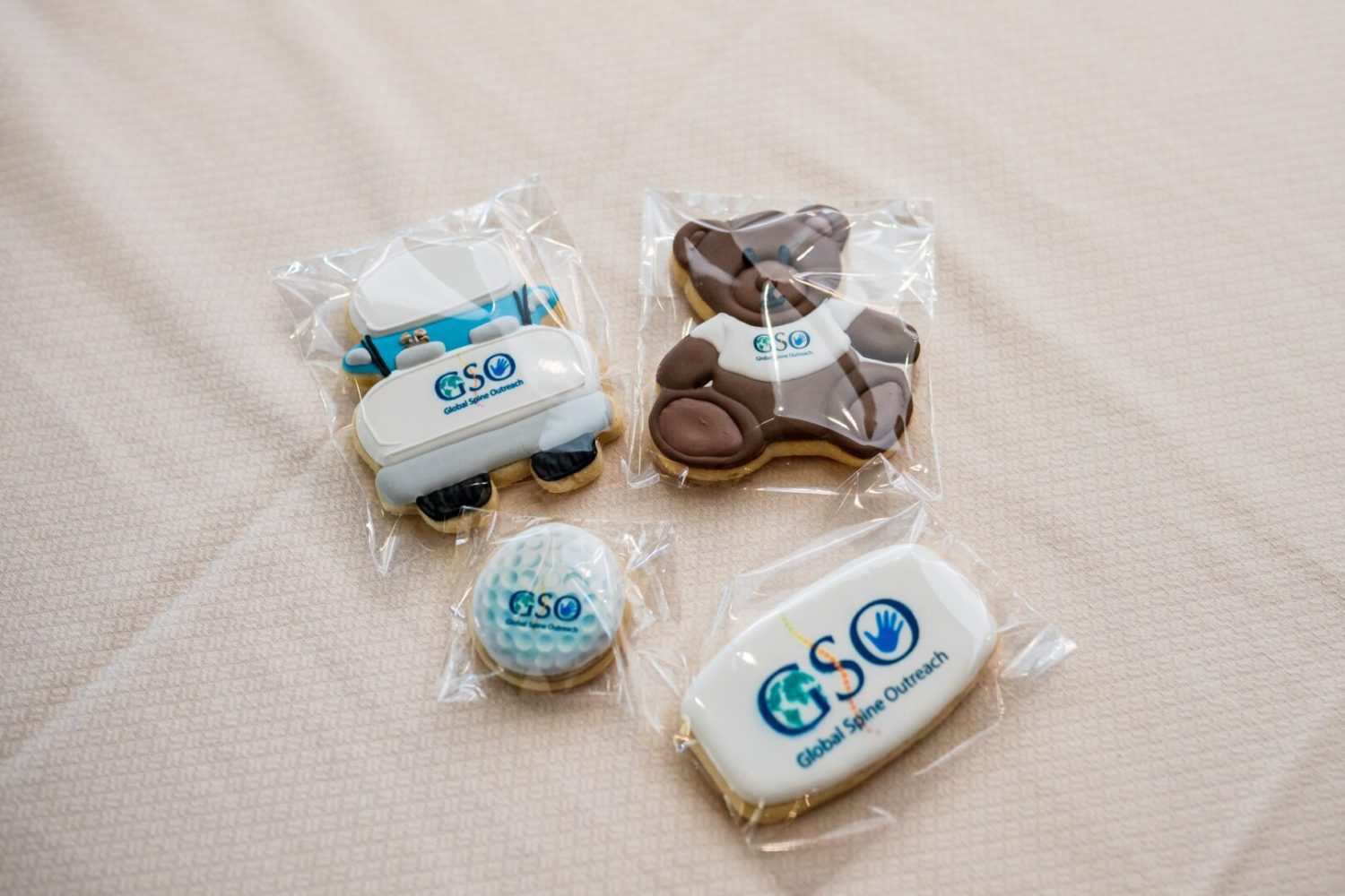 A variety of cookies are displayed in plastic bags.