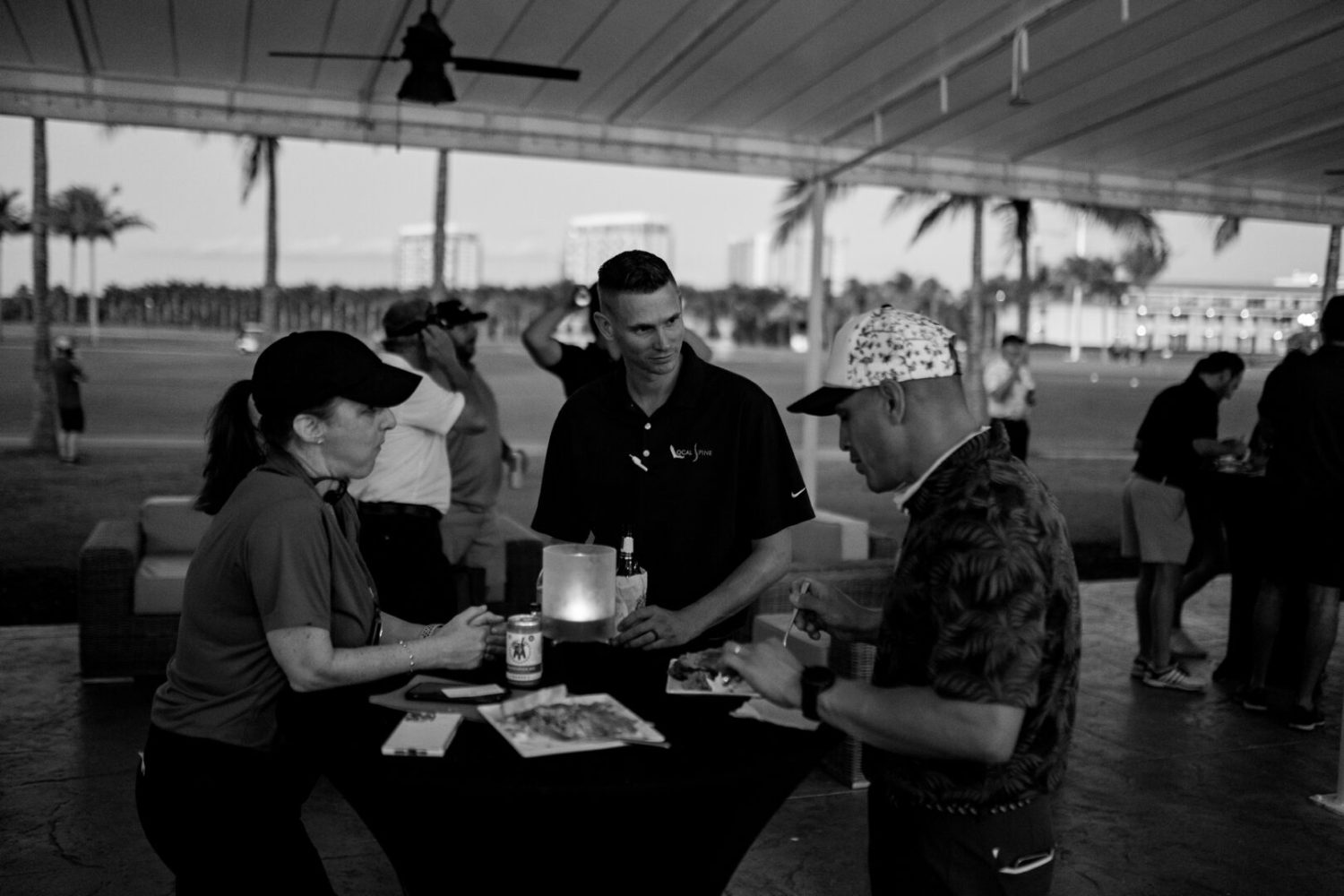 A group of people sitting around a table.