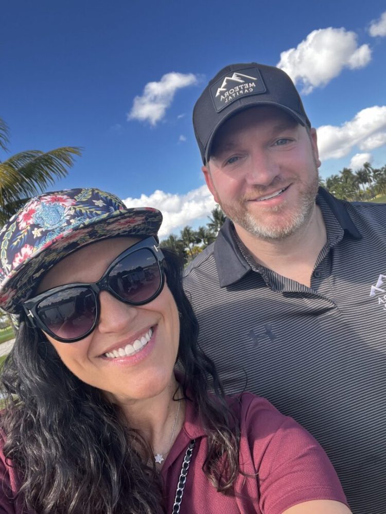 A man and woman smiling for the camera.