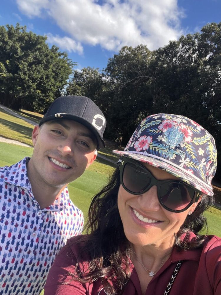 A man and woman are smiling for the camera.