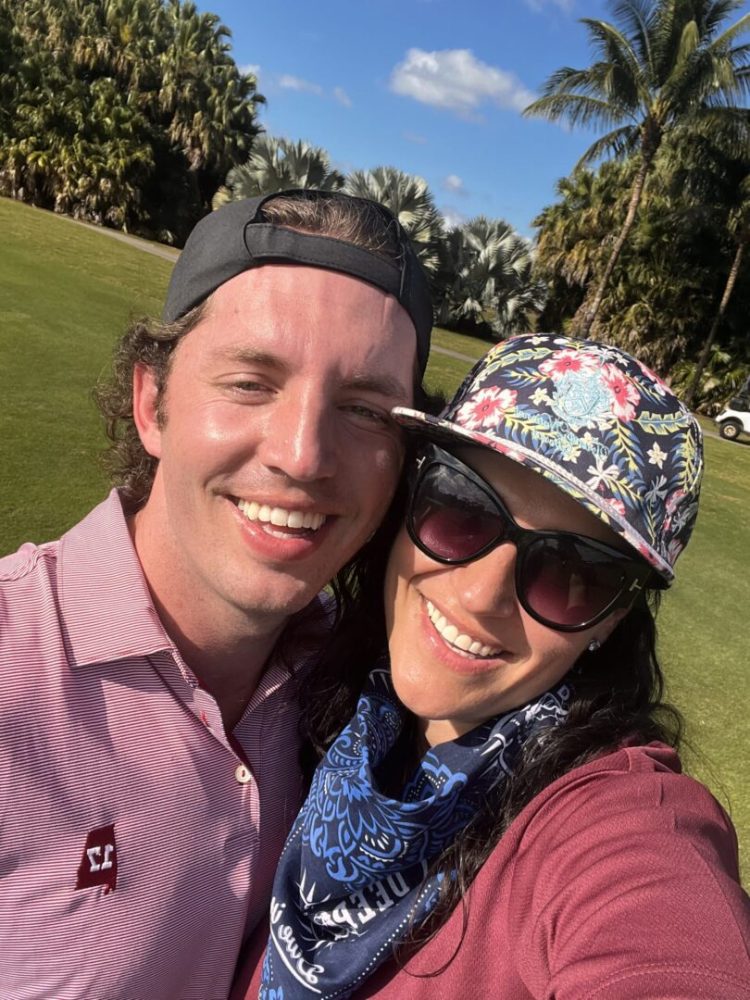 A man and woman smiling for the camera.