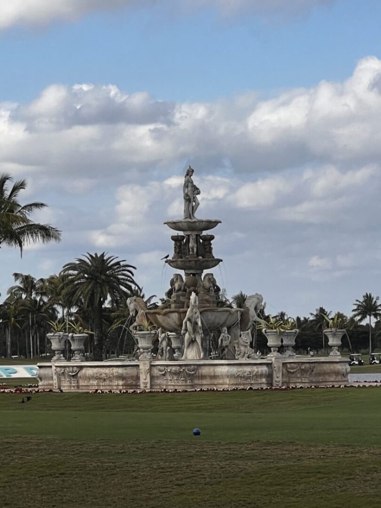 A large fountain in the middle of a park.