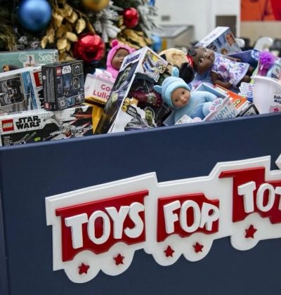 A blue box with toys for tots written on it.